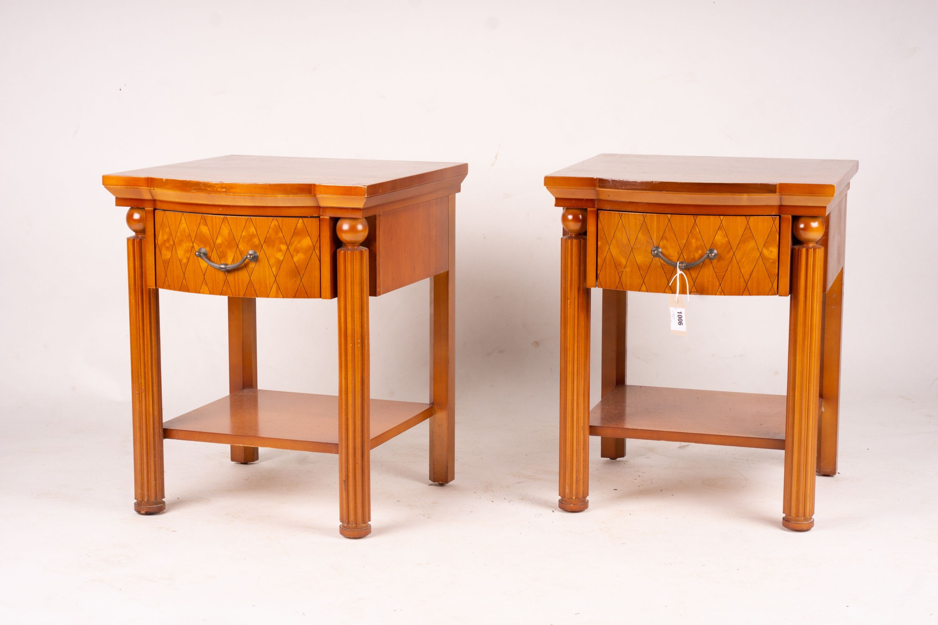 A pair of mahogany bowfront bedside cabinets, width 50cm, depth 50cm, height 62cm